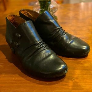 taos booties. slip on black leather booties, with stone embellishments.